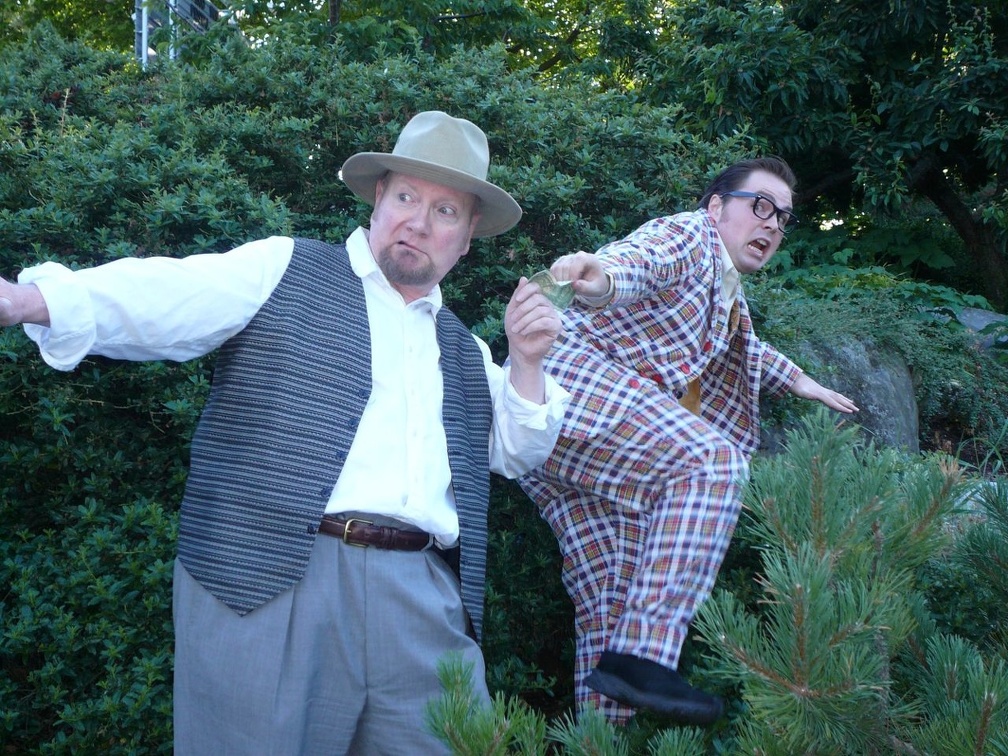 Floy (Nathaniel Jones) and Pontdue (Mick Etchoe) run after being discovered by the Keystone Cops.