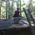     Sarah sweeping off roof and removing old roofing